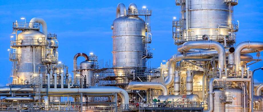 Petrochemical columns and pipework at blue hour