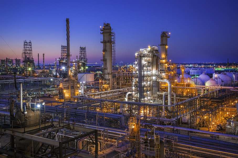 Refinery facilities illuminated at dusk